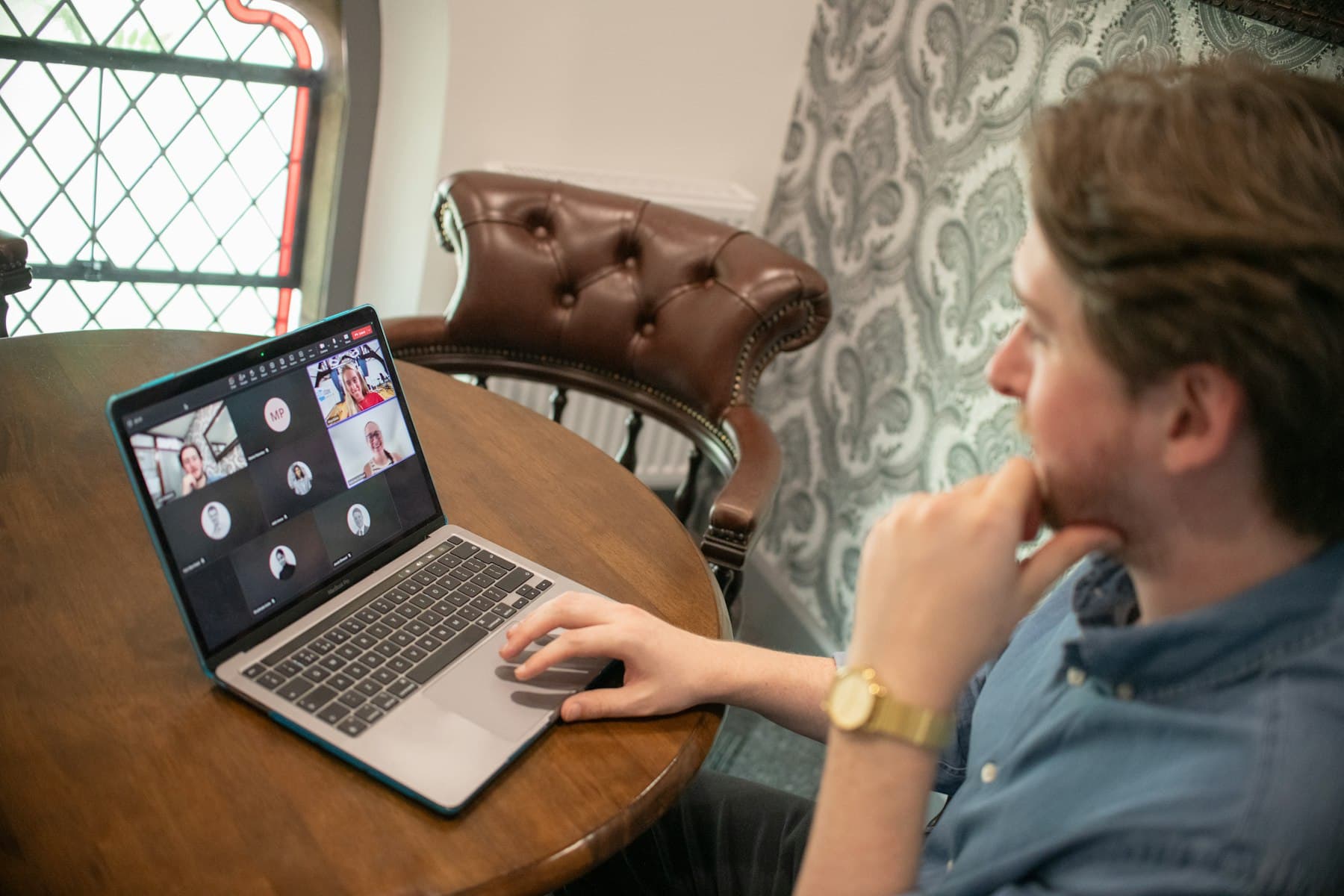 An engineer on a video call with his team